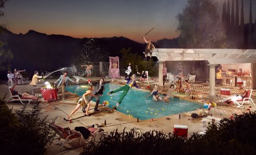 A surreal, cinematic photograph of a chaotic poolside party at dusk, shot in color film with warm golden and turquoise tones.